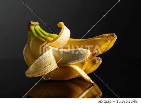 Bananas on a black reflective background. Bananas on a black reflective background. 131951849