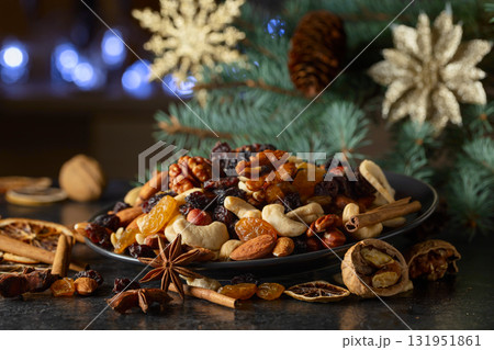 Dried tropical fruits with various nuts and raisins. Dried tropical fruits with various nuts and raisins. 131951861