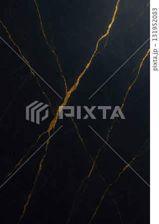 Black marble texture featuring fine golden veins and polished reflective surface 131952083