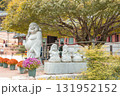 An old maple tree, a Maitreya Buddha, and a stone statue of a young monk at Jangansa Temple in Gijang, Busan, South Korea 131952152