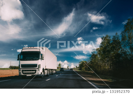Truck On Country Road. Tractor Unit, Prime Mover, Traction Unit In Motion On Countryside Road In Europe. Business Transportation And Trucking Industry Concept 131952370