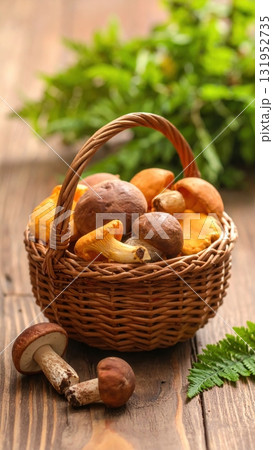 Fresh organic mushrooms in a wicker basket on an isolated white background for a healthy autumn diet Fresh organic mushrooms in a wicker basket on an isolated white background for a healthy autumn diet 131952735