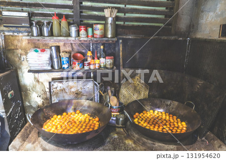Rustic Basket Of Small Orange Fruits On Wooden Table Beside 131954620