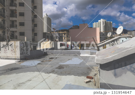 Rooftop Scene With Graffiti, Stairway, and City Skyline 131954647