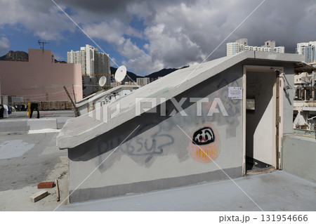 Rooftop Scene With Graffiti, Stairway, and City Skyline 131954666