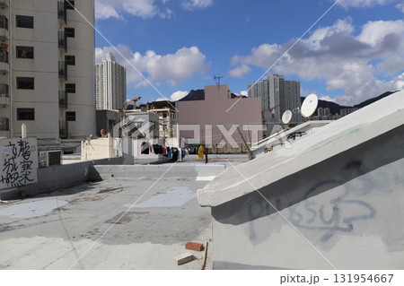 Rooftop Scene With Graffiti, Stairway, and City Skyline Rooftop Scene With Graffiti, Stairway, and City Skyline 131954667