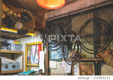 Sept 27 2025 Old Workshop With Hoses, Belts, And Tools Hanging From Ceiling 131955213