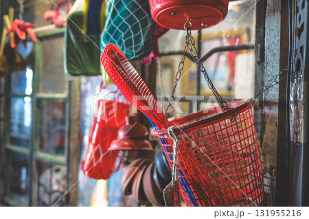 Sept 27 2025 Bright Red Basket and Hanging Tools in a Busy Shop Sept 27 2025 Bright Red Basket and Hanging Tools in a Busy Shop 131955216