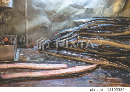 Sept 27 2025 Stacked Eels In A Cold Market Kitchen With Wet Surfaces Sept 27 2025 Stacked Eels In A Cold Market Kitchen With Wet Surfaces 131955264