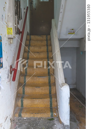 Sept 27 2025 Narrow Staircase Inside Old Building With Red Handrail 131955380