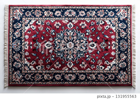 Handwoven Persian rug texture on a white background. Top view. 131955563