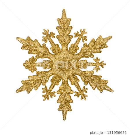 A Christmas decorative tree ornament in the shape of a golden shiny snowflake, isolated on a white background with clipping path. Design element for Christmas card 131956623
