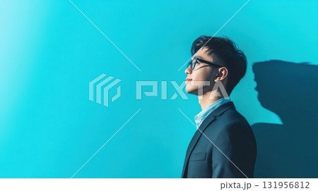 Man in suit looks toward a bright future. Man in suit looks toward a bright future. 131956812