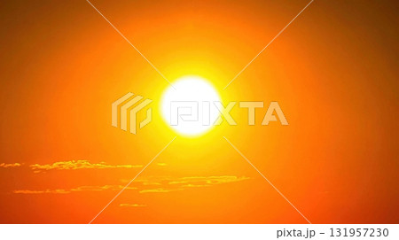 Bright Sun in a Fiery Orange Sky. Bright Sun in a Fiery Orange Sky. 131957230