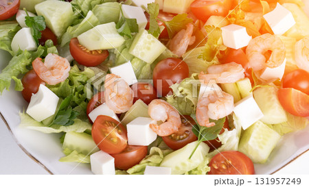 A salad with shrimp, tomatoes, and cucumbers A salad with shrimp, tomatoes, and cucumbers 131957249