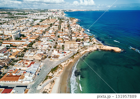 Aerial view of Mediterranean coastal town in Spain Aerial view of Mediterranean coastal town in Spain 131957889