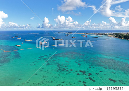 沖縄県大浦湾と遠景の辺野古埋め立て地を空撮した風景 131958524
