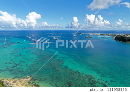 沖縄県大浦湾と遠景の辺野古埋め立て地を空撮した風景 131958526