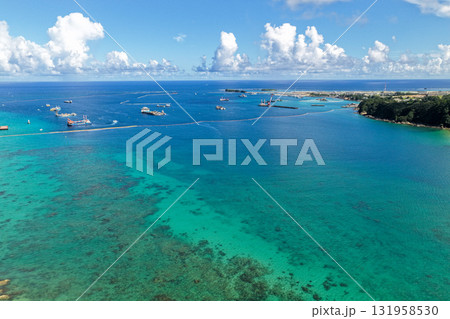 沖縄県大浦湾と遠景の辺野古埋め立て地を空撮した風景 131958530