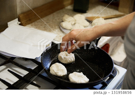 Senior Christmas cook prepares tasty pancake at home 131958656