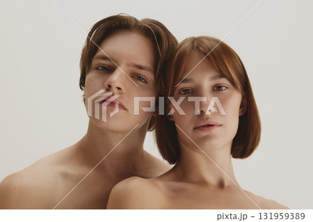 Confident couple with natural bare skin showing skincare perfection 131959389