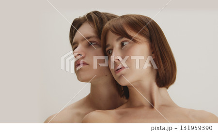 Modern artistic beauty portrait of couple looking aside in quiet balance 131959390