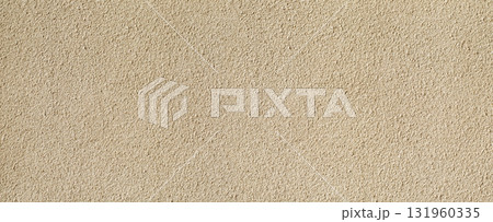 Beige textured plaster wall background providing copy space Beige textured plaster wall background providing copy space 131960335