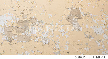 Old wall showing peeling paint and crumbling plaster texture 131960341