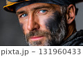 Portrait of mature male caucasian miner with helmet and blackened face. 131960433