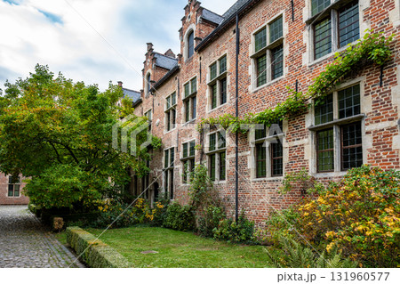 Brick houses and garden in Groot Begijnhof Leuven Brick houses and garden in Groot Begijnhof Leuven 131960577