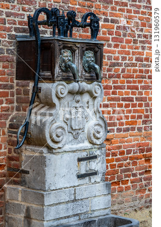 Old water pump in Groot Begijnhof Leuven Old water pump in Groot Begijnhof Leuven 131960579