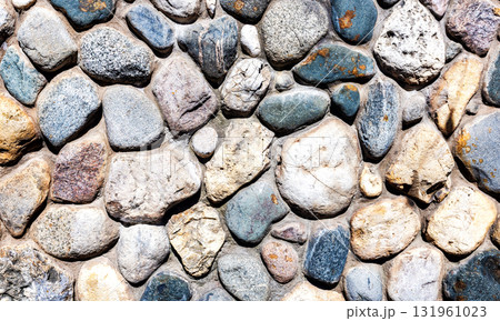 Rough stone wall as creative background texture. Natural stones masonry. Stone wall background Rough stone wall as creative background texture. Natural stones masonry. Stone wall background 131961023