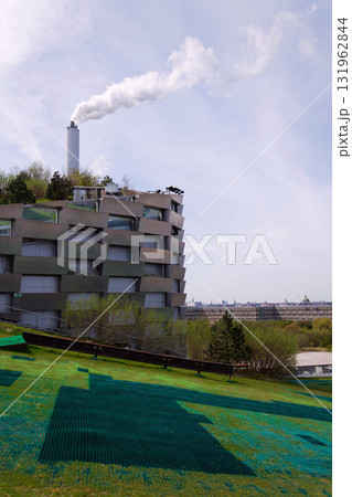Amager Bakke known as Amager Slope or Copenhill, combined heat and power waste to energy plant with recreational facility, dry ski run and hiking trail, Copenhagen, Denmark 131962844