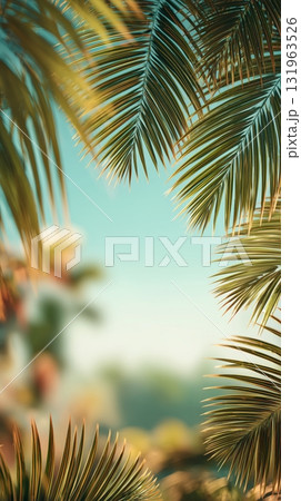 Lush Green Palm Leaves Frame a Serene Tropical Scene in Soft Morning Light Lush Green Palm Leaves Frame a Serene Tropical Scene in Soft Morning Light 131963526