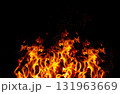 Bright, blazing fire flames and sparks on a black background. Orange and yellow flames. 131963669