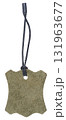 Blank suede tag in grayish green on a black cord with a tip. Isolated background. 131963677