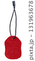 Red suede tag or label on a black cord, isolated background. Blank price tag. 131963678