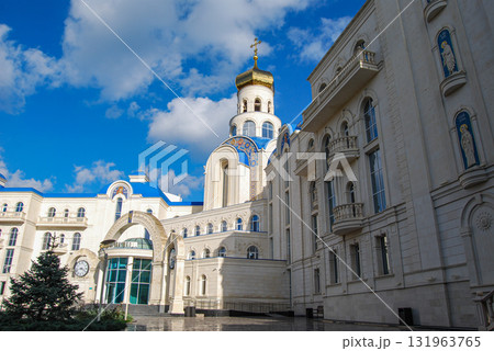 The building of the international academic school in Odessa. The richly decorated building with neoclassical architecture has a central golden dome topped with a cross. The building of the international academic school in Odessa. The richly decorated building with neoclassical architecture has a central golden dome topped with a cross. 131963765