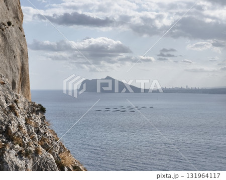 Experience a breathtaking, scenic seascape that features a stunning coastal mountain view 131964117