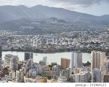 Breathtaking Aerial Viewshowcasing Cityscape Nestled Amidst Majestic Mountain Ranges Breathtaking Aerial Viewshowcasing Cityscape Nestled Amidst Majestic Mountain Ranges 131964121