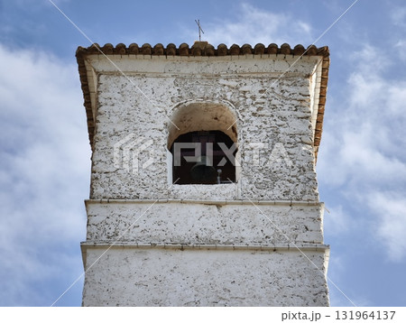 A Historic Bell Tower Stands Majestically Against a Blue Sky, Highlighting Its Beauty 131964137