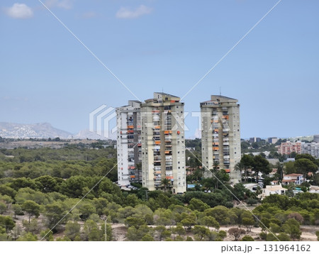 Contemporary Modern HighRise Buildings Gracefully Surrounded by Lush, Vibrant Greenery 131964162