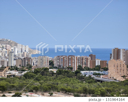 Experience a stunning coastal view of a modern city beautifully situated by the sea 131964164