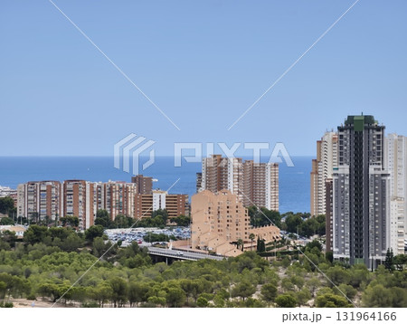 A stunning coastal cityscape that beautifully overlooks the vast expanse of the sea 131964166