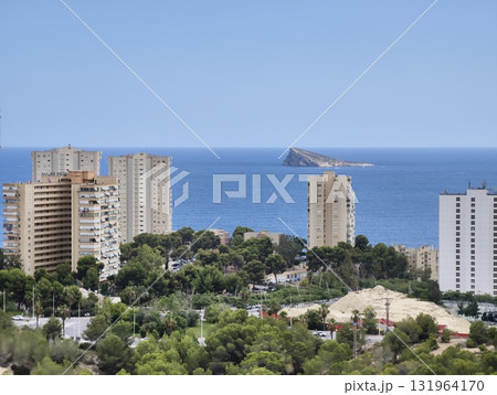 A picturesque scenic coastal view that showcases a vibrant urban landscape alongside the blue ocean 131964170