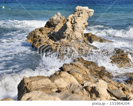 Breathtaking and Scenic Rocky Seashore with Waves Crashing Against the Rugged Coastline 131964204