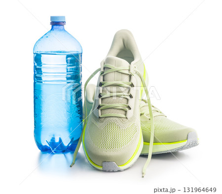 Sport running shoes and water bottle  isolated on white background. 131964649