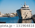 A huge white yacht moored at the dock 131964818