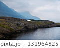 Rocky coastline near a black sand beach in southern Iceland 131964825