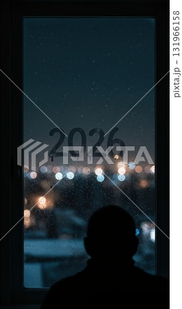 A person's dark silhouette gazes through a rain-streaked window with 2026 written on the glass, overlooking a blurred urban nightscape. A person's dark silhouette gazes through a rain-streaked window with 2026 written on the glass, overlooking a blurred urban nightscape. 131966158